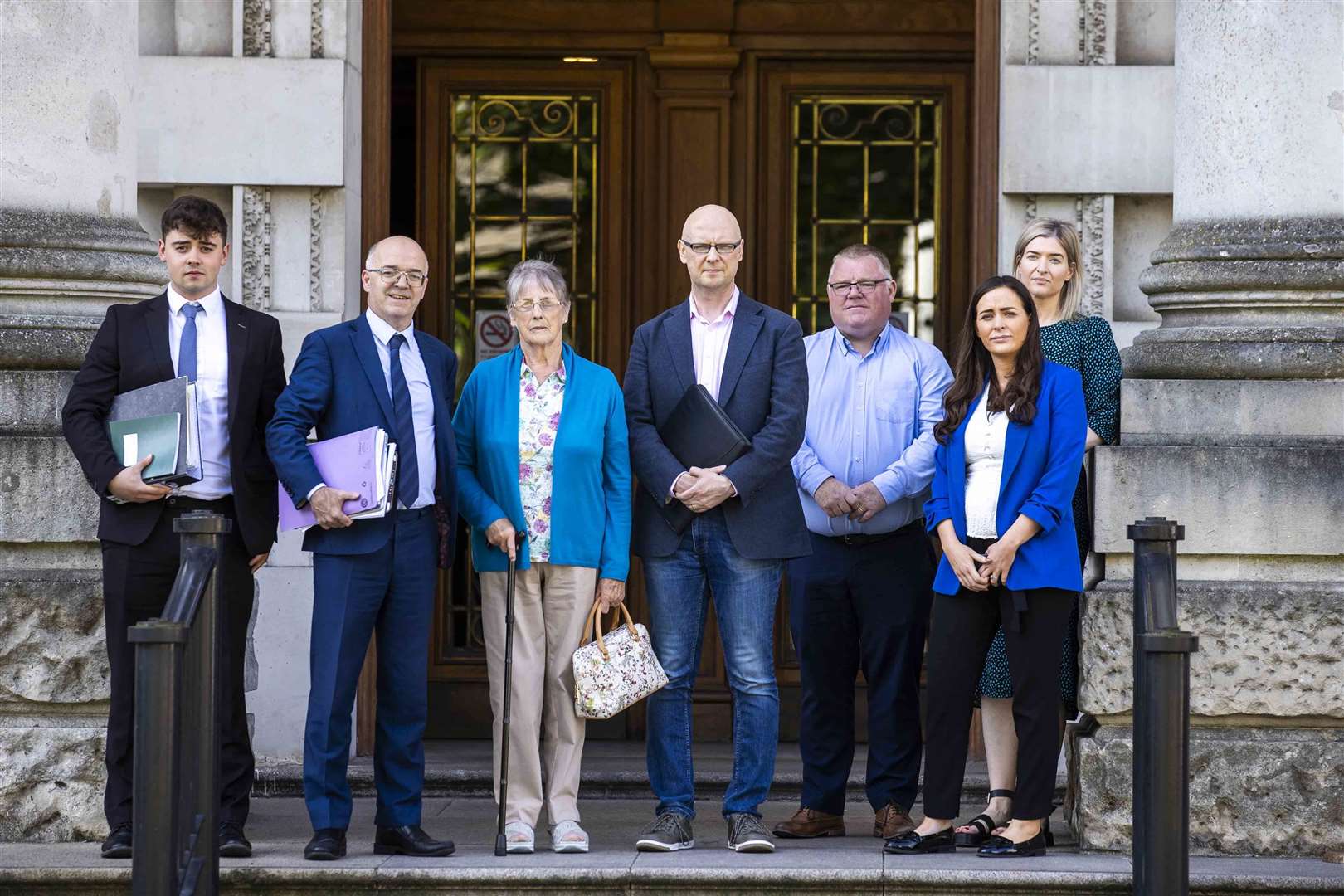 (L to R) Solicitors Darragh O’Kane and Adrian O’Kane, Patsy Kelly’s widow Teresa, son Patsy Kelly Jr, and Sinn Fein representatives Declan McAleer MLA, Orfhlaith Begley MP, and Nicola Brogan MLA at the High Court in Belfast (Liam McBurney/PA)