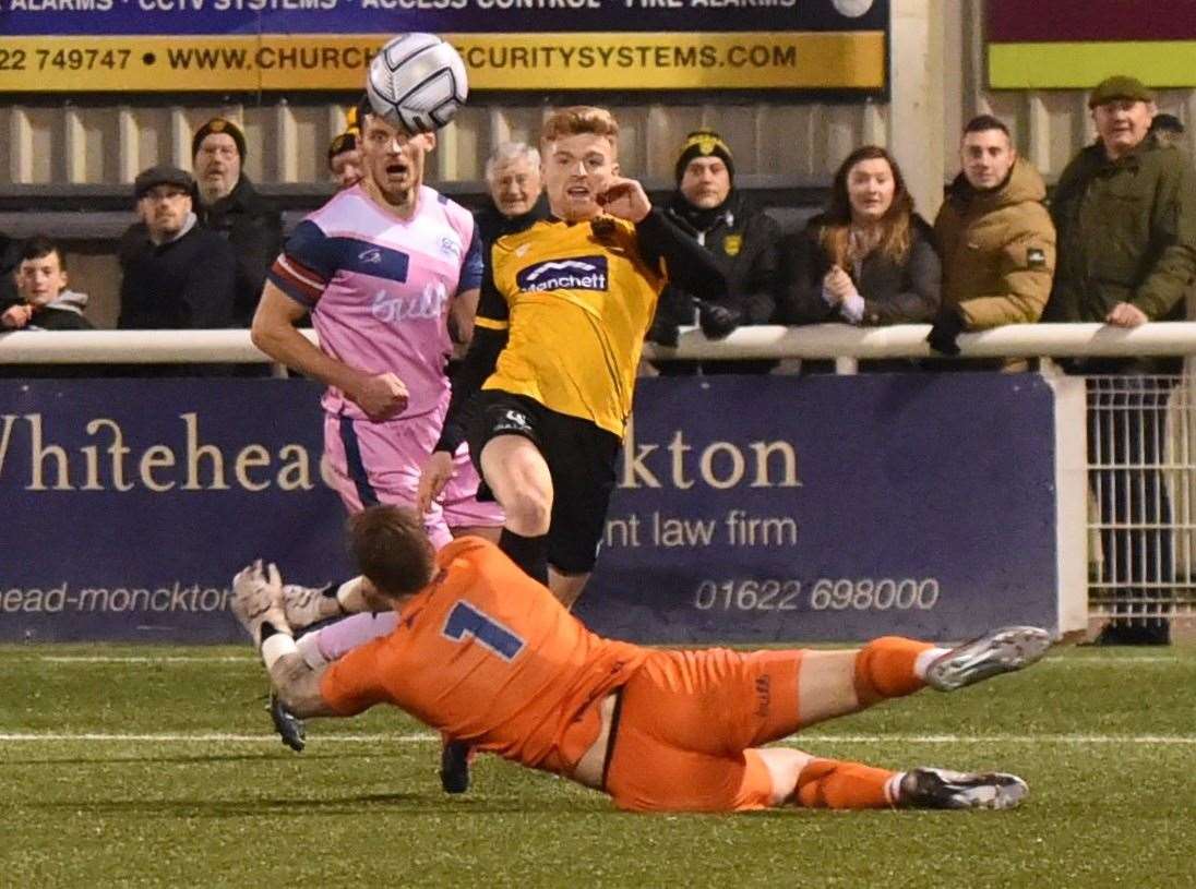 Maidstone striker Jack Barham dinks the ball over Dulwich goalkeeper Charlie Grainger. Picture: Steve Terrell