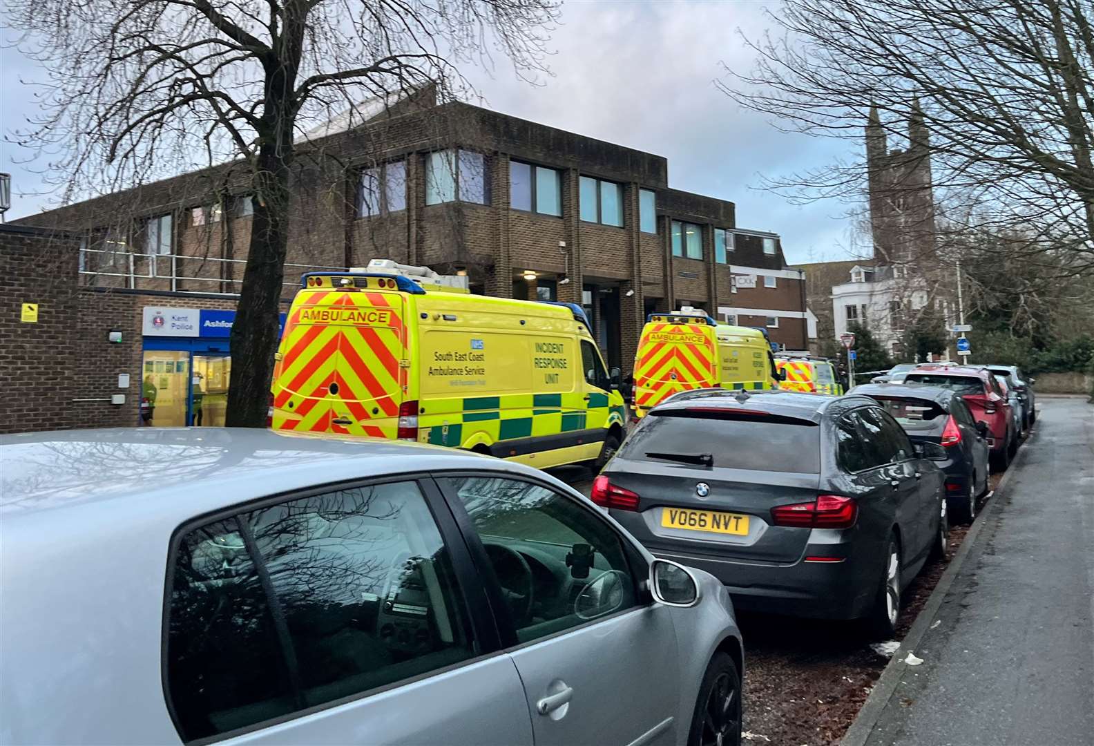 Three ambulances were parked in Church Road, outside Ashford police station
