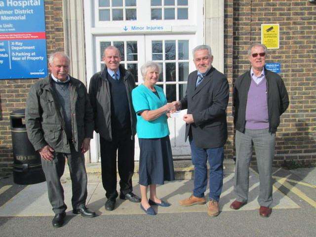 Friends of Deal Hospital chairman Doris Thompson receives a cheque from master of the Downs Lodge branch of the Freemasons Ivor Winham at the London Road hospital