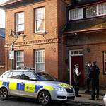 Police outside the bedsit in Victoria Road, Canterbury, where Loretta Ralipys's body was found