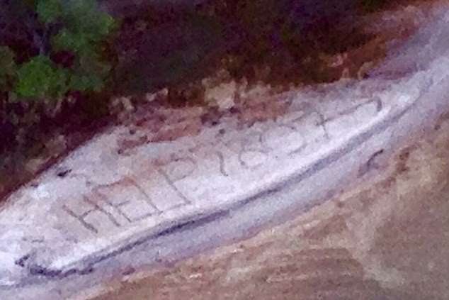 The message Geoff Keys scrawled in the sand. Picture via Queensland police