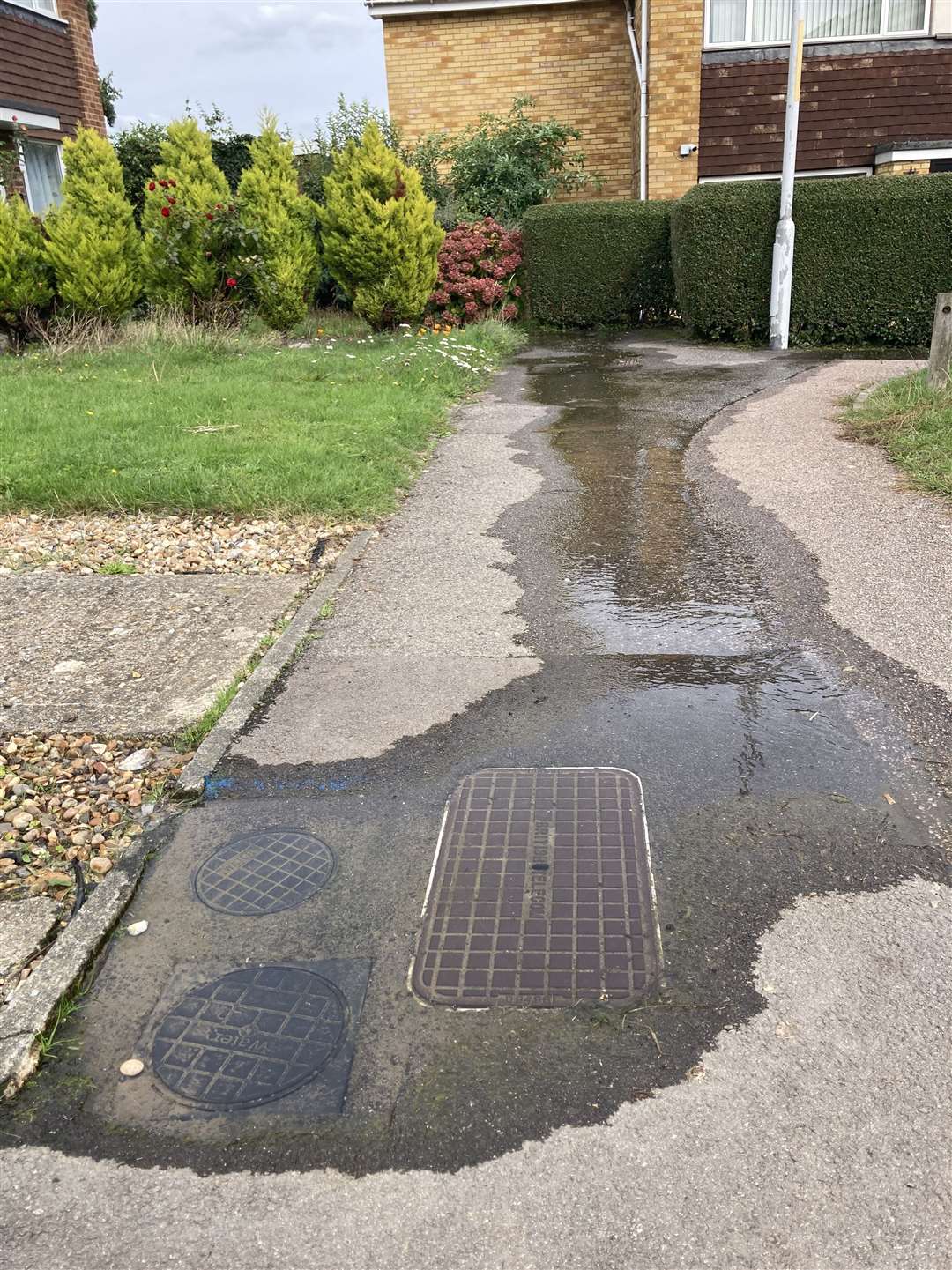 The water leak in Norwood Walk West off Hilton Drive, Sittingbourne