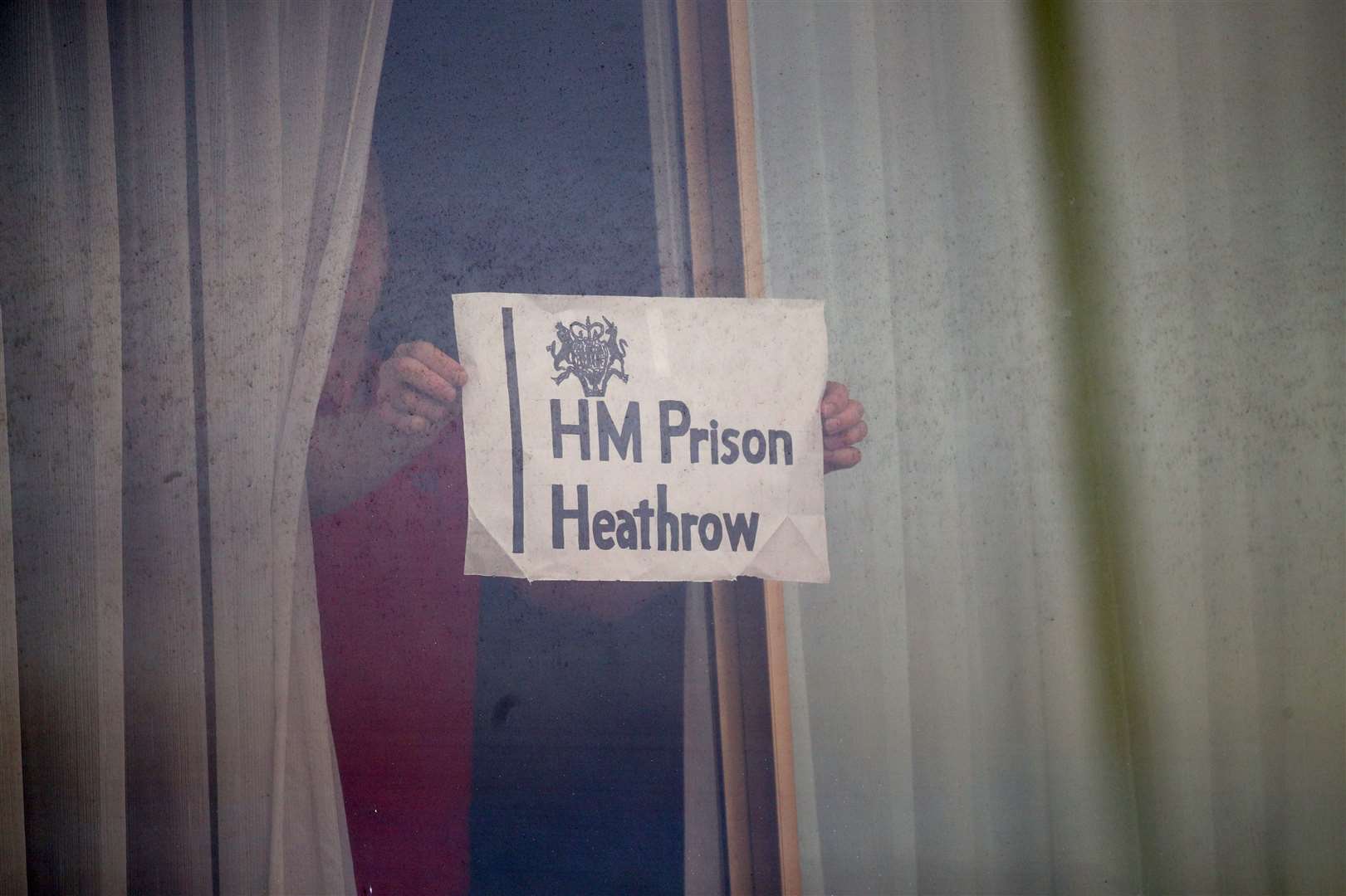 A man in quarantine at the Renaissance London Heathrow Hotel (Yui Mok/PA)