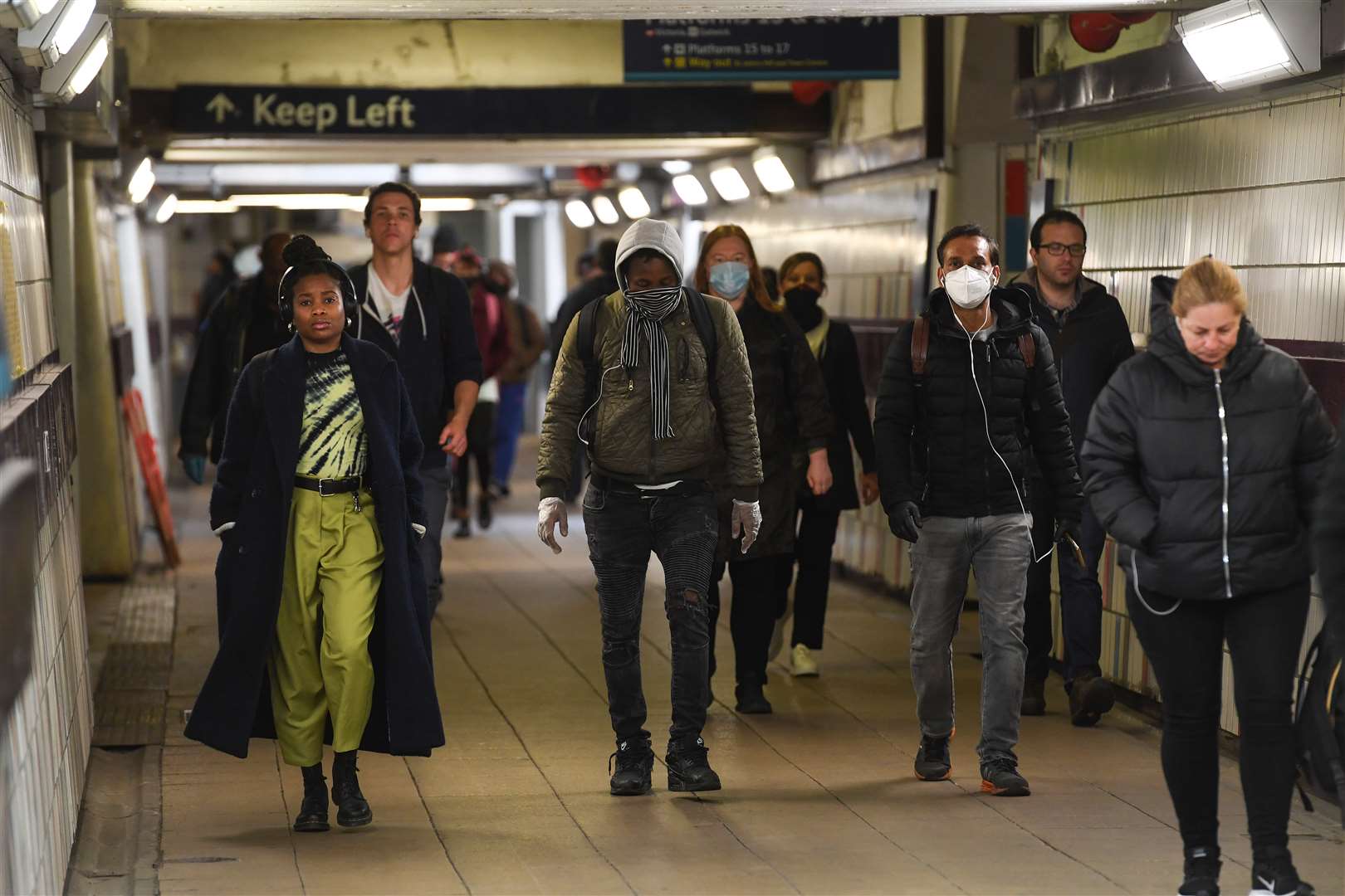 Passengers wear face masks in the underpass at Clapham Junction station (Kirsty O’Connor/PA)
