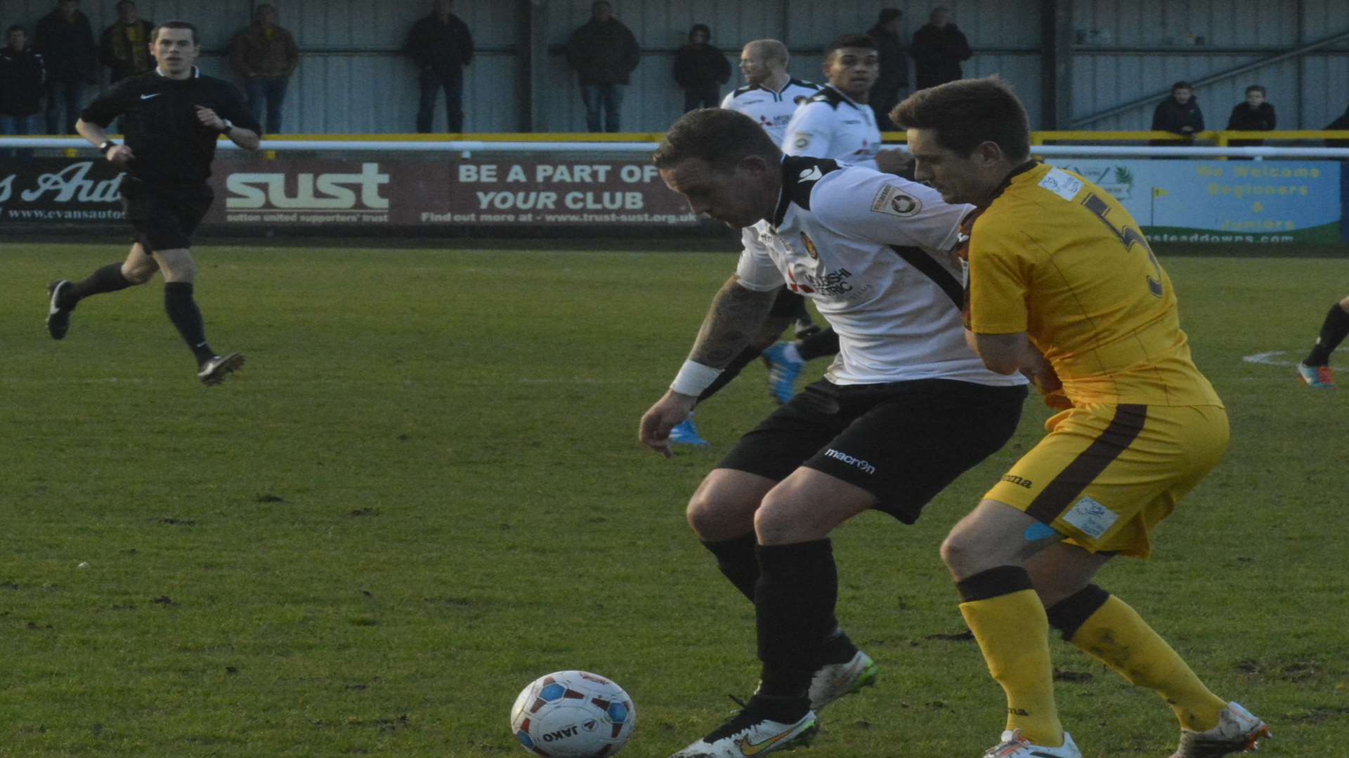 Danny Kedwell tussles with Sutton defender Shaun Cooper Picture: Paul Jarvis