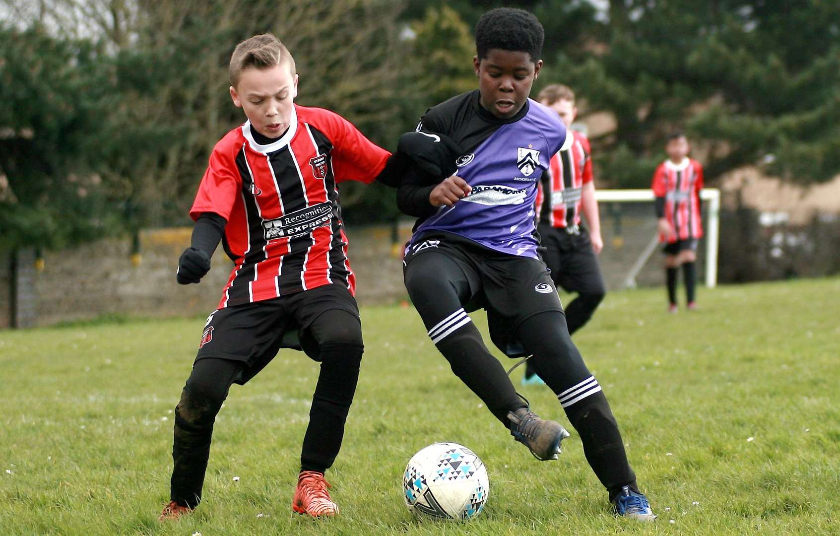 Strood United under-11s (red) battle Anchorians Panthers under-11s Picture: Phil Lee FM31638695