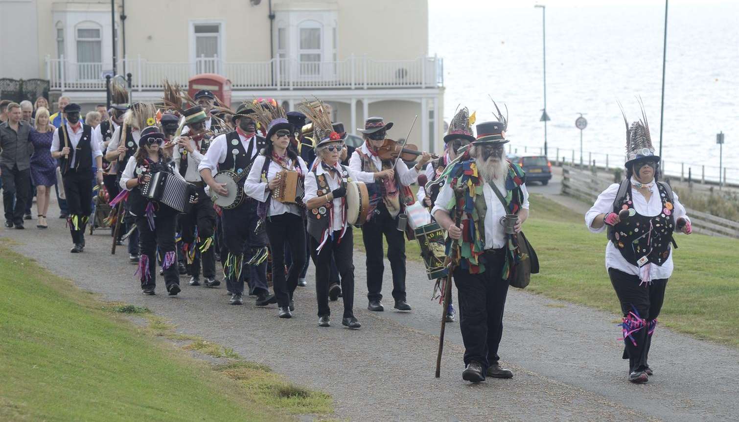 Morris dancers leading the funeral procession to the Kings Hall