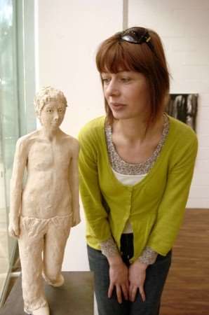 Rachel Lorenson with her exhibit called Walking Boy.