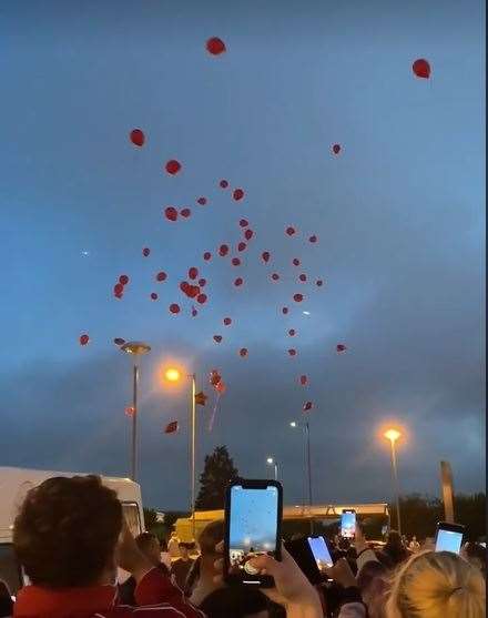 Members of the Dirtee South Sheppey car club gathered in Neats Court retail park car park at Queenborough, Sheppey, and released red balloons in memory of Cavan Scott. Picture: Ricky Bain