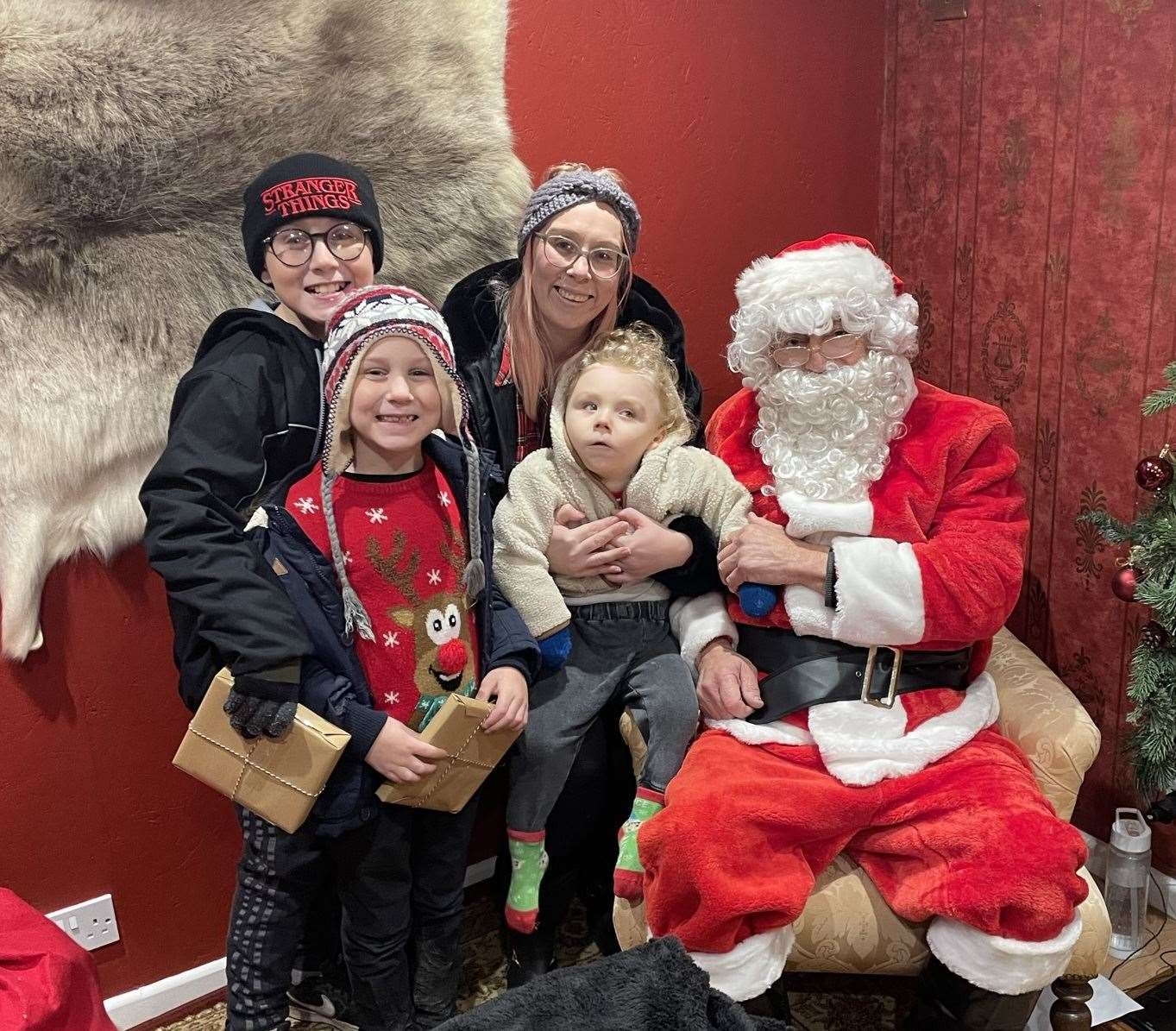 Mum Jasmine Legg with sons, Thomas, Frankie and Jayden, and Father Christmas. Picture: Jasmine Legg