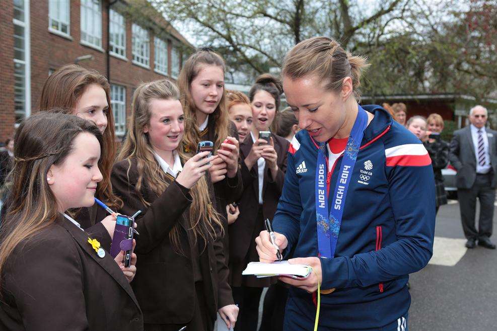 Lizzy Yarnold signing autographs on arrival