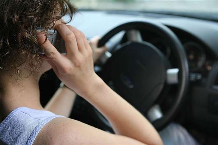 Motorists are reminded they cannot drive and use their phones