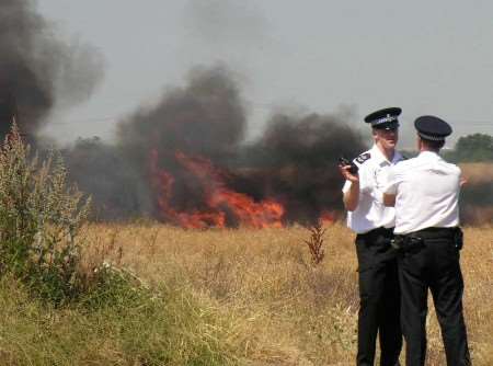 Police at the scene of the blaze. Picture: PETER BASSETT