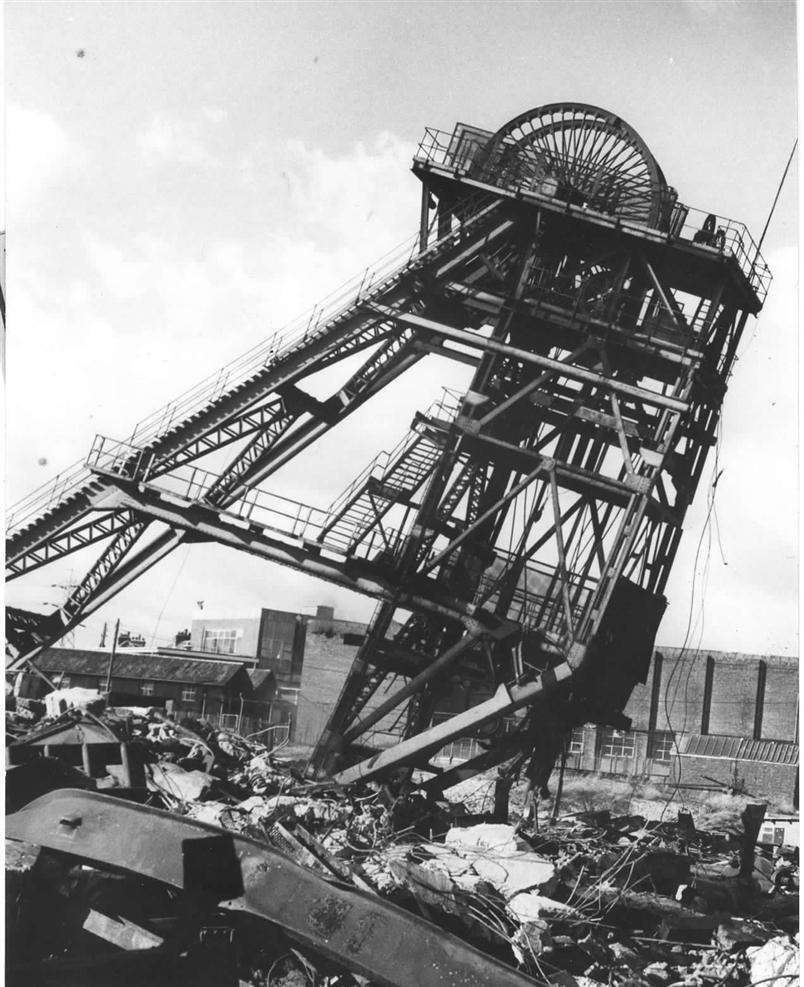 A picture of the headgear at Betteshanger toppling down when the pit was demolished a year after it closed in 1990