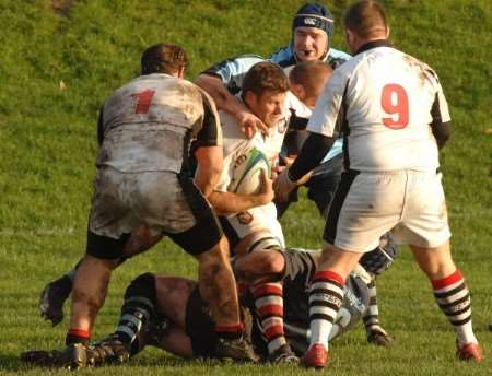 Sheppey (white shirts) battle for possession against Old Gravesendians