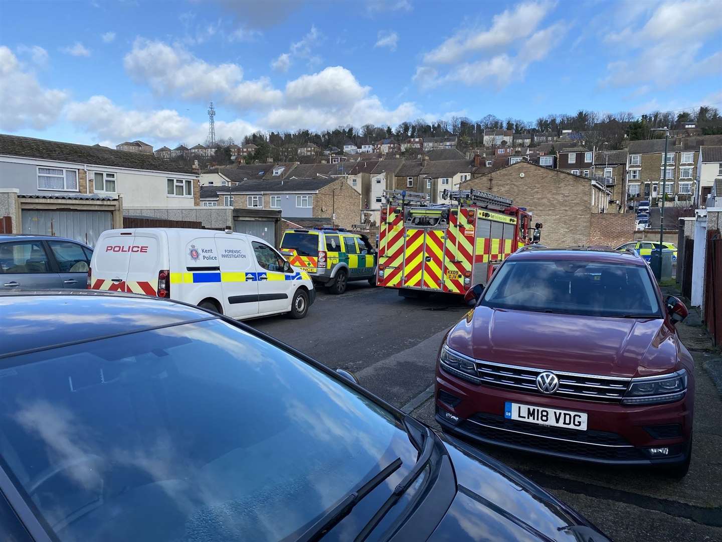 Neighbours have spotted police cars, ambulances, forensic vans, and ambulances at the scene