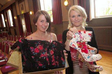 Rae-Emily Smith and Kelly May with a dress donated by the pop singer Lily Allen and a pair of shoes donated by Marina and the Diamonds
