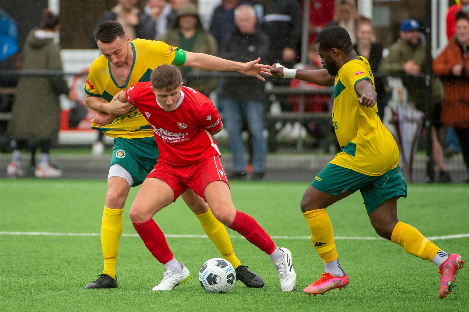 Hollands & Blair (red) battle Ashford United in the FA Cup last weekend Picture: Ian Scammell