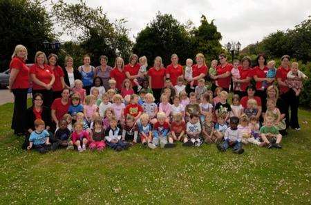 Staff and children from Happy Days Nursery, Ferry Road, Iwade, celebrate their outstanding Ofsted report