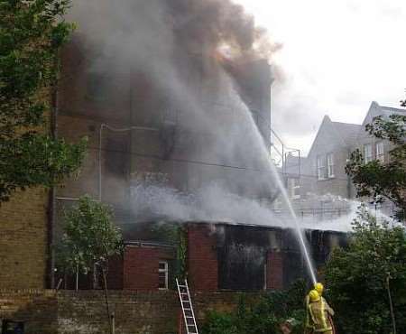 Firefighters tackle the flames. Picture: MIKE PETT