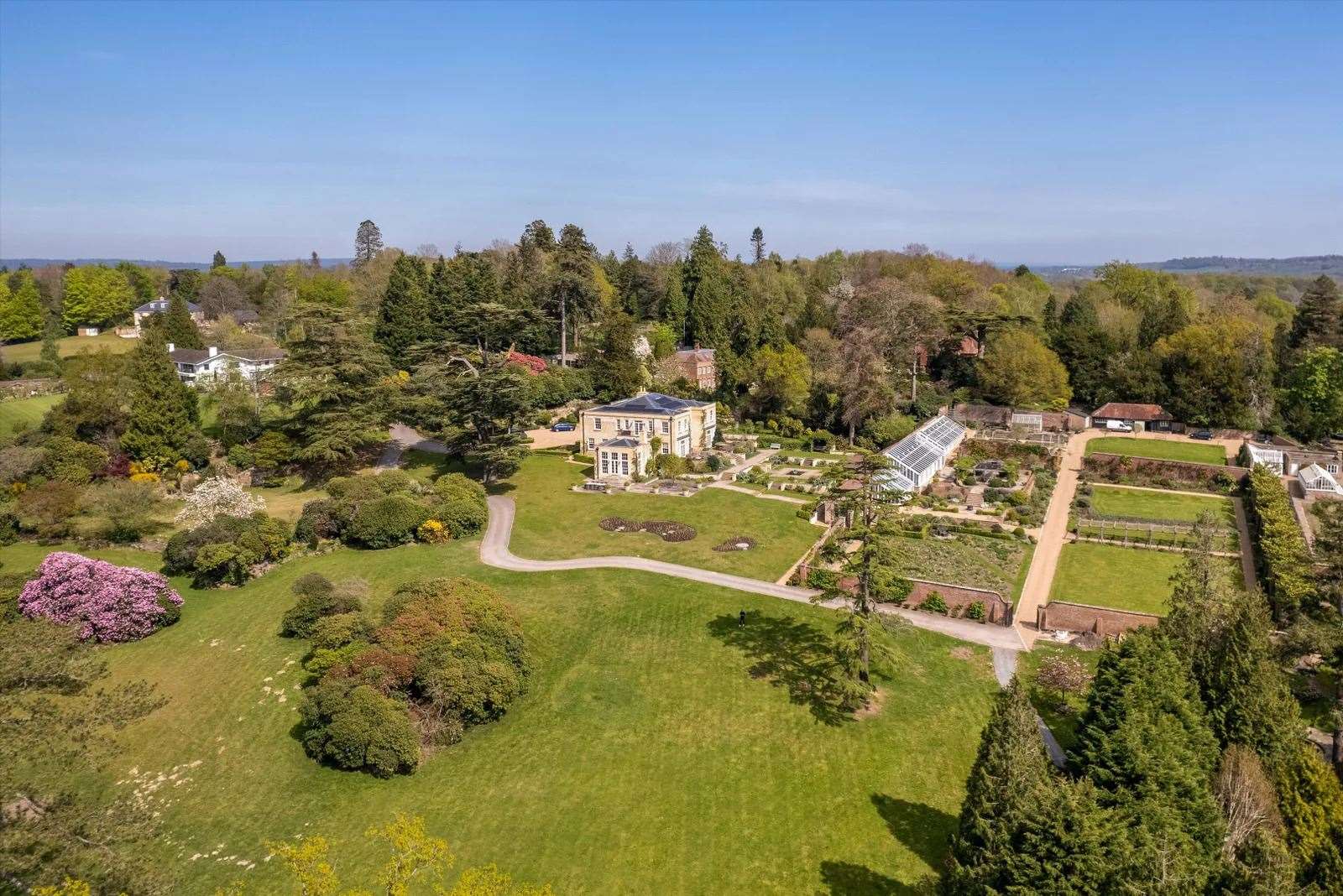 The home is surrounded by 12.8 acres of parkland, woodland and gardens. Picture: Knight Frank