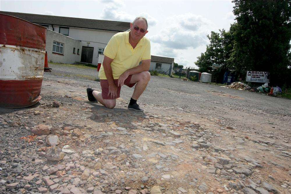 Sheerness East Working Men's Club manager Dave Smith shows the damaged car park surface