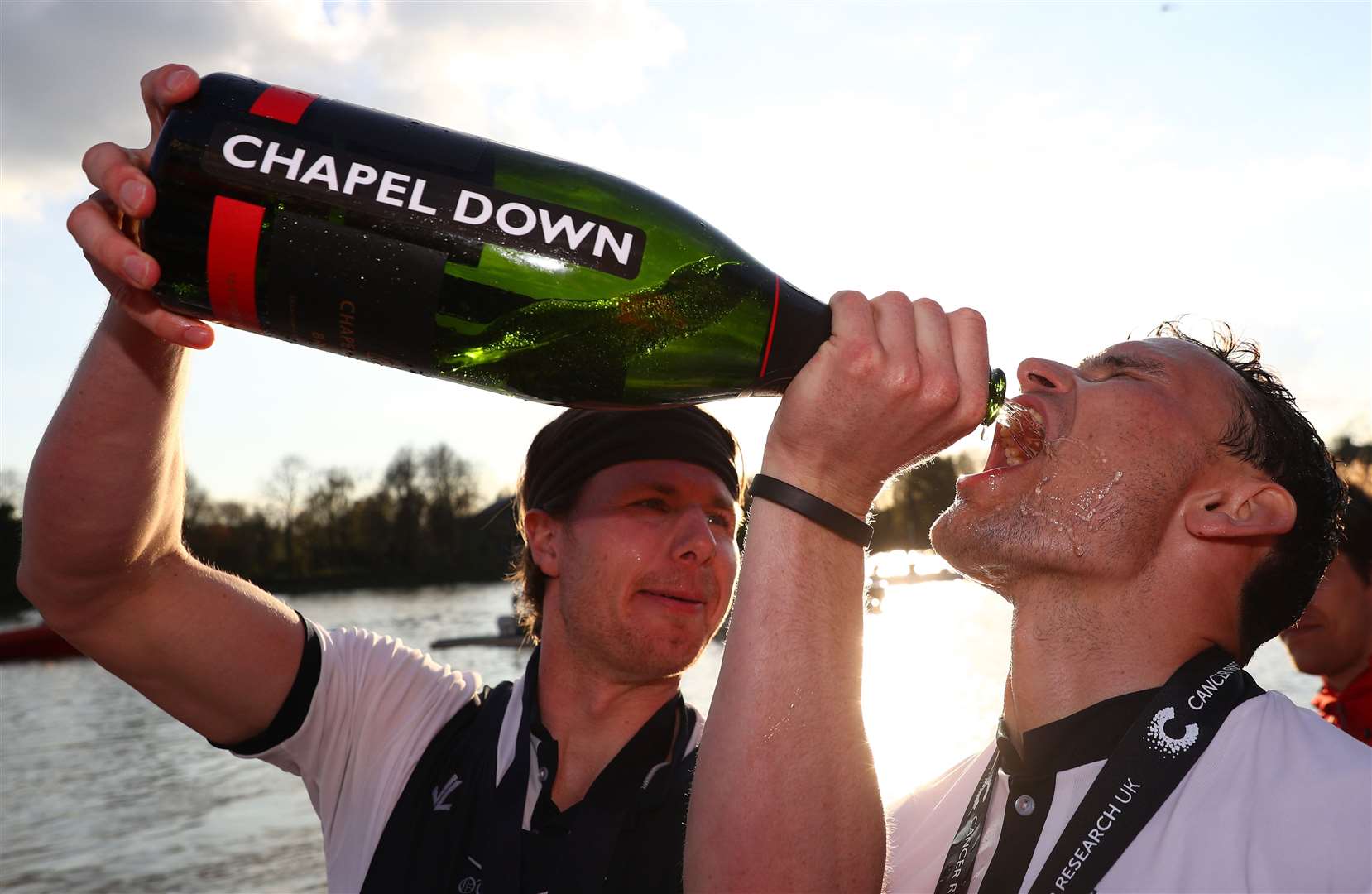 Victors in the men's Boat Race celebrate with Chapel Down Brut