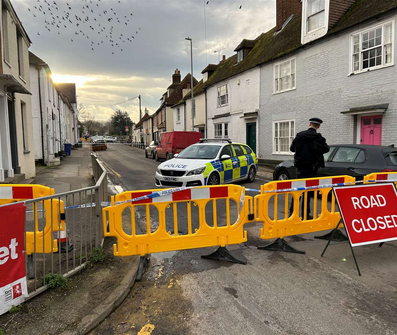 Police cordoned off the main route through the village after they launched a murder investigation