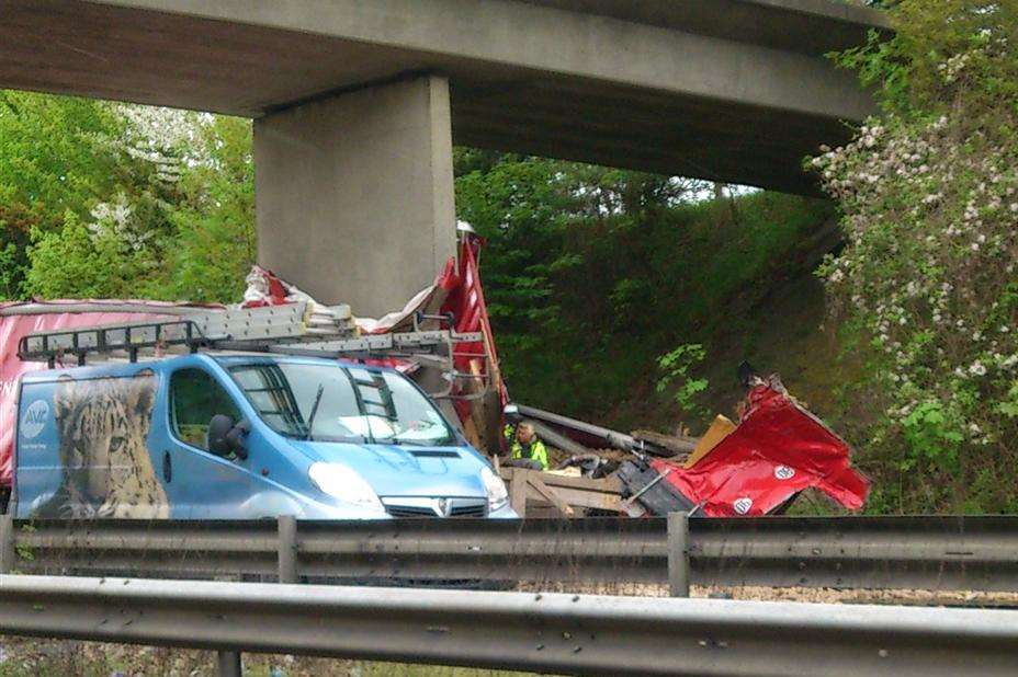 Wreckage of the red lorry that hit a bridge on the A2, killing Polish driver Henryk Konopacki Picture: Bun Johnson