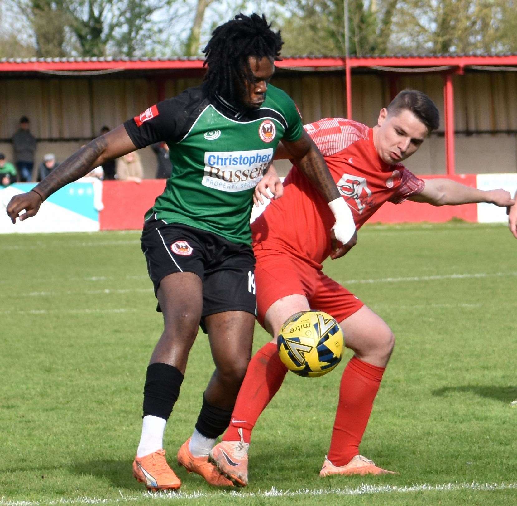 Match action between Hythe (red) and Phoenix Sports last month. Picture: Randolph File