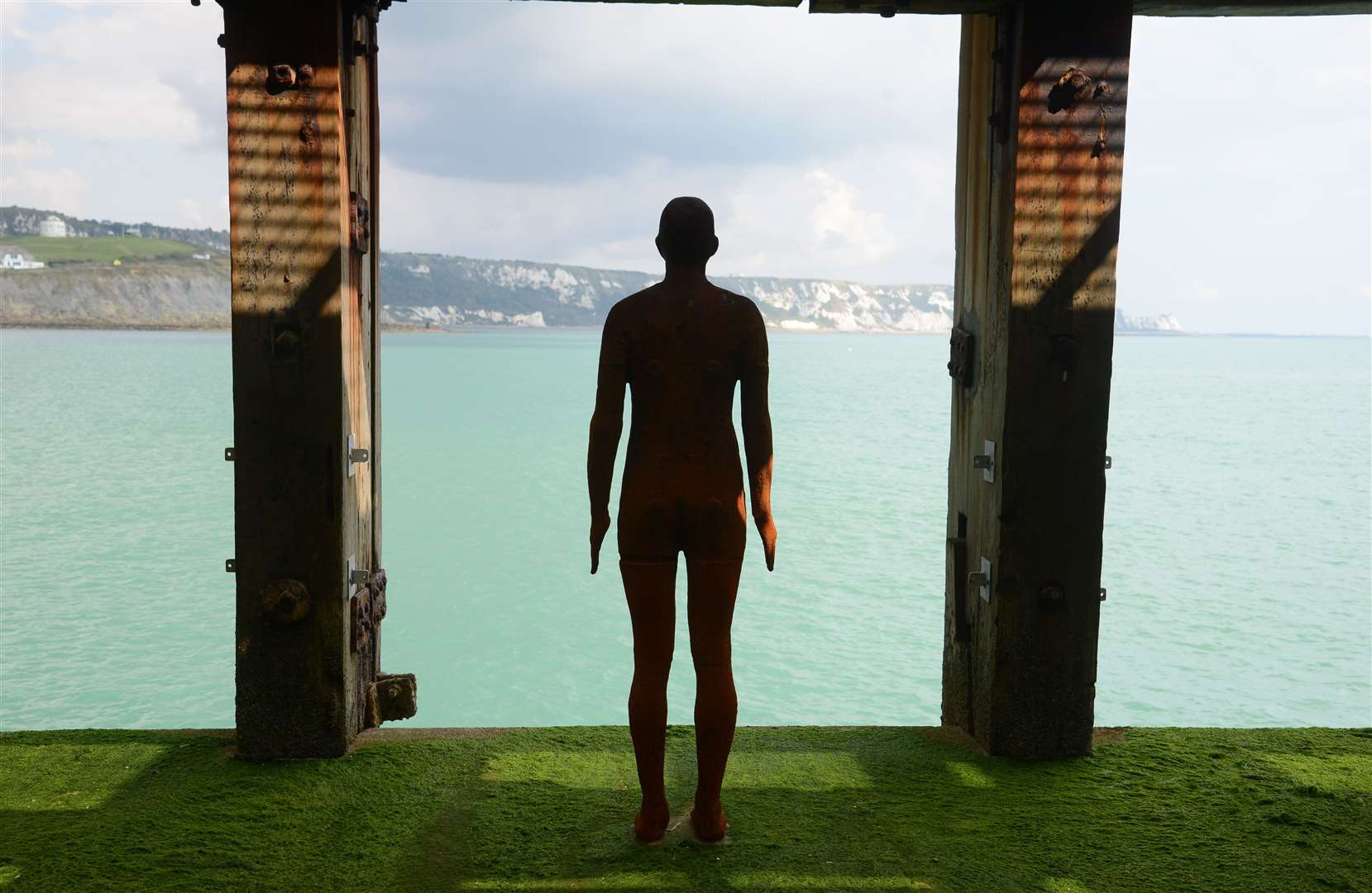 Statues of sculptor Antony Gormley are in place in both Folkestone (pictured here) and Margate. Picture: Gary Browne