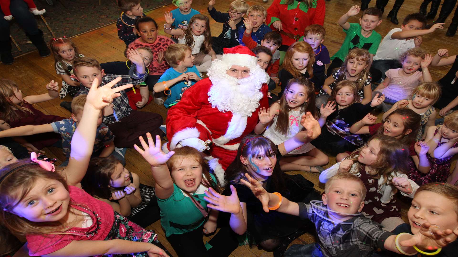 Youngsters with Santa at St George's Primary School cherry class Christmas disco at Minister Working Men's Club