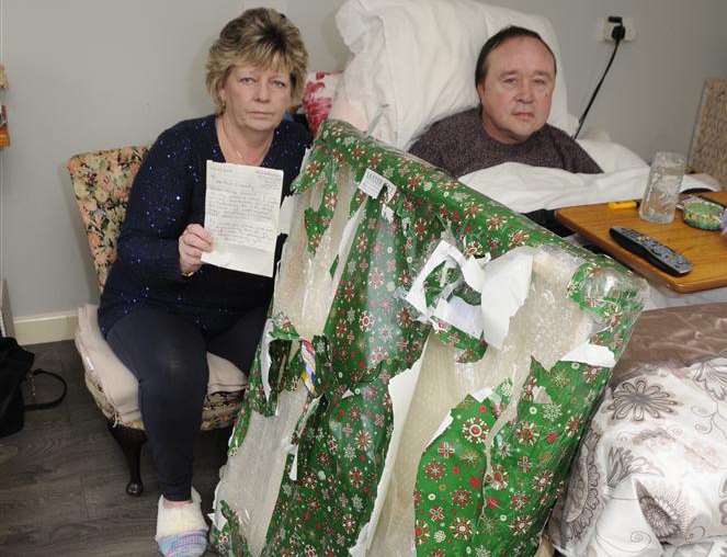 Deborah Green and husband Paul with the letter and parcel she sent to Paul O'Grady