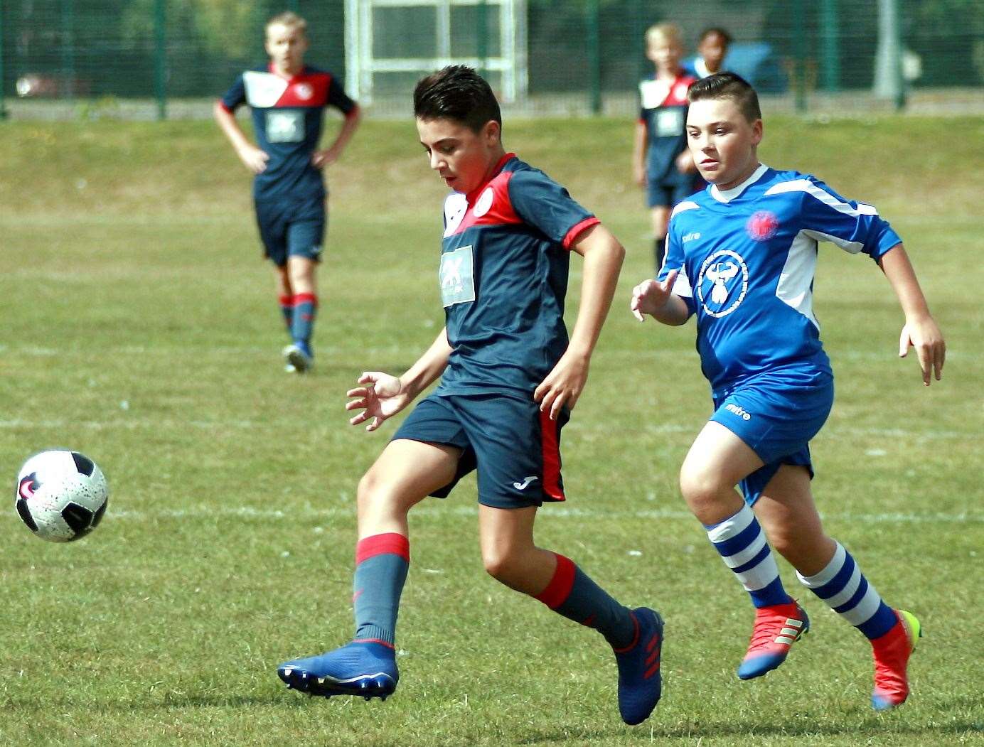 Hempsted Valley Rangers (blue/red) battle Northfleet Eagles White in Under-14 Division 1 Picture: Phil Lee