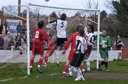 A scramble in the Dover penalty area during Monday's match. Picture: CHRIS DAVEY