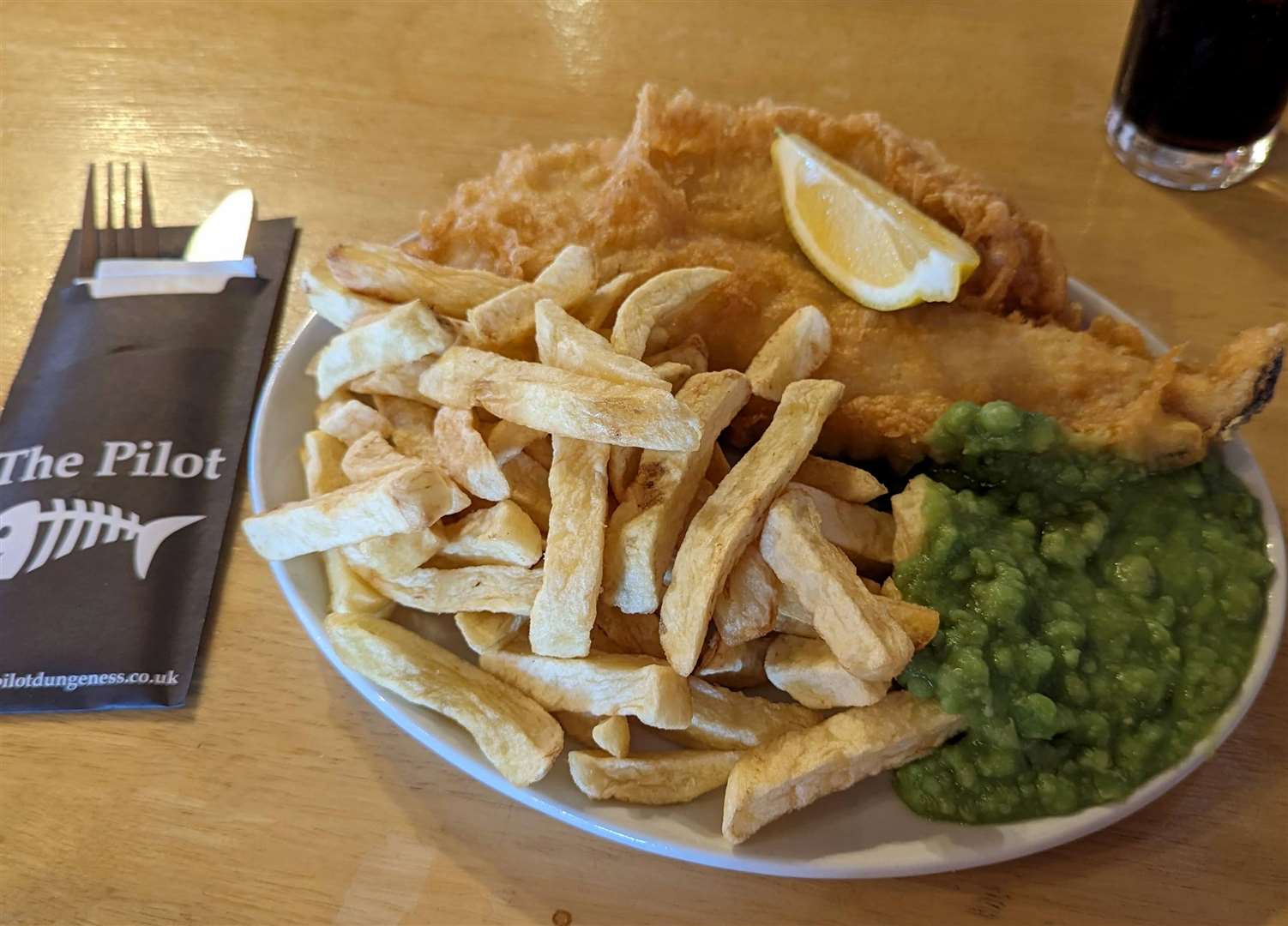 A medium portion of cod and chips – which is still straining at the edges of the plate
