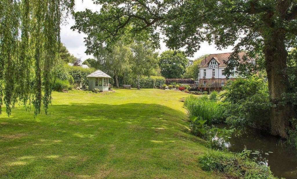 The gardens include a gazebo and lake. Picture: Harpers and Hurlingham