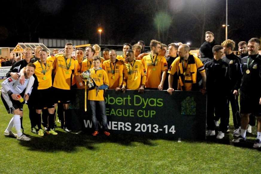 Jack Gilby (holding trophy) joins Maidstone's League Cup celebrations Picture: Steve Terrell
