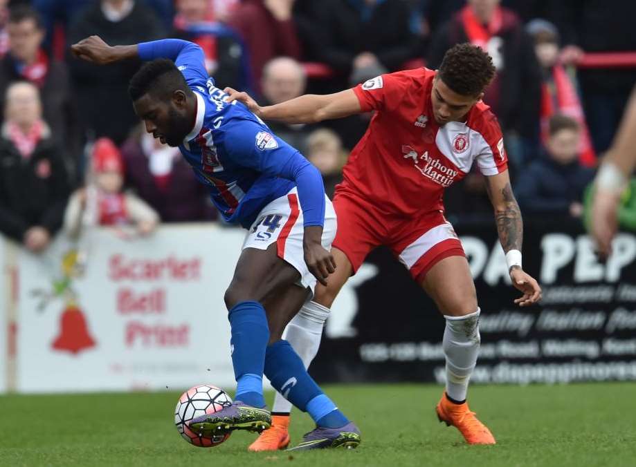 Welling's Harry Osborne has his work cut out against Jabo Ibehre. Picture: Keith Gillard