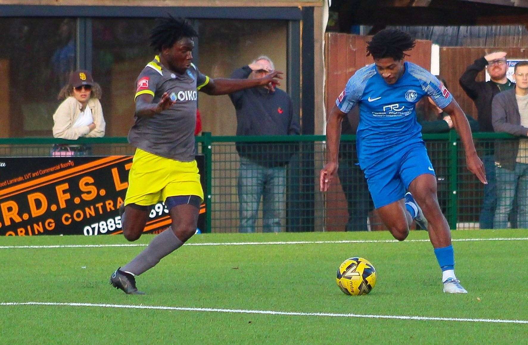 Herne Bay's Kymani Thomas this season running at a Canvey Island defender. Picture: Keith Davy