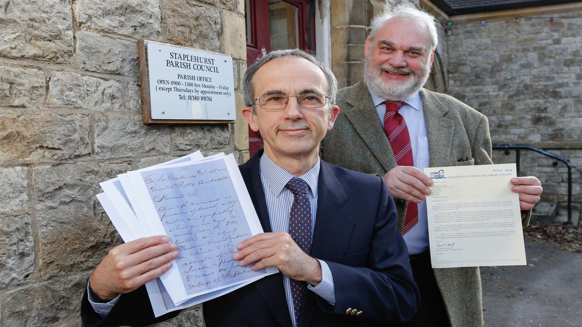 Staplehurst Parish clerk Mick Westwood, and chairman Rory Silkin, with a letter originally sent by a Staplehurst resident 150 years ago offering condolences after the assassination of Abraham Lincoln. Picture: Matthew Walker