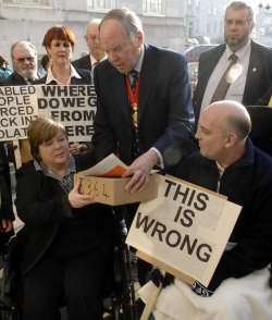 Protesters present their petition to KCC chairman Leyland Ridings