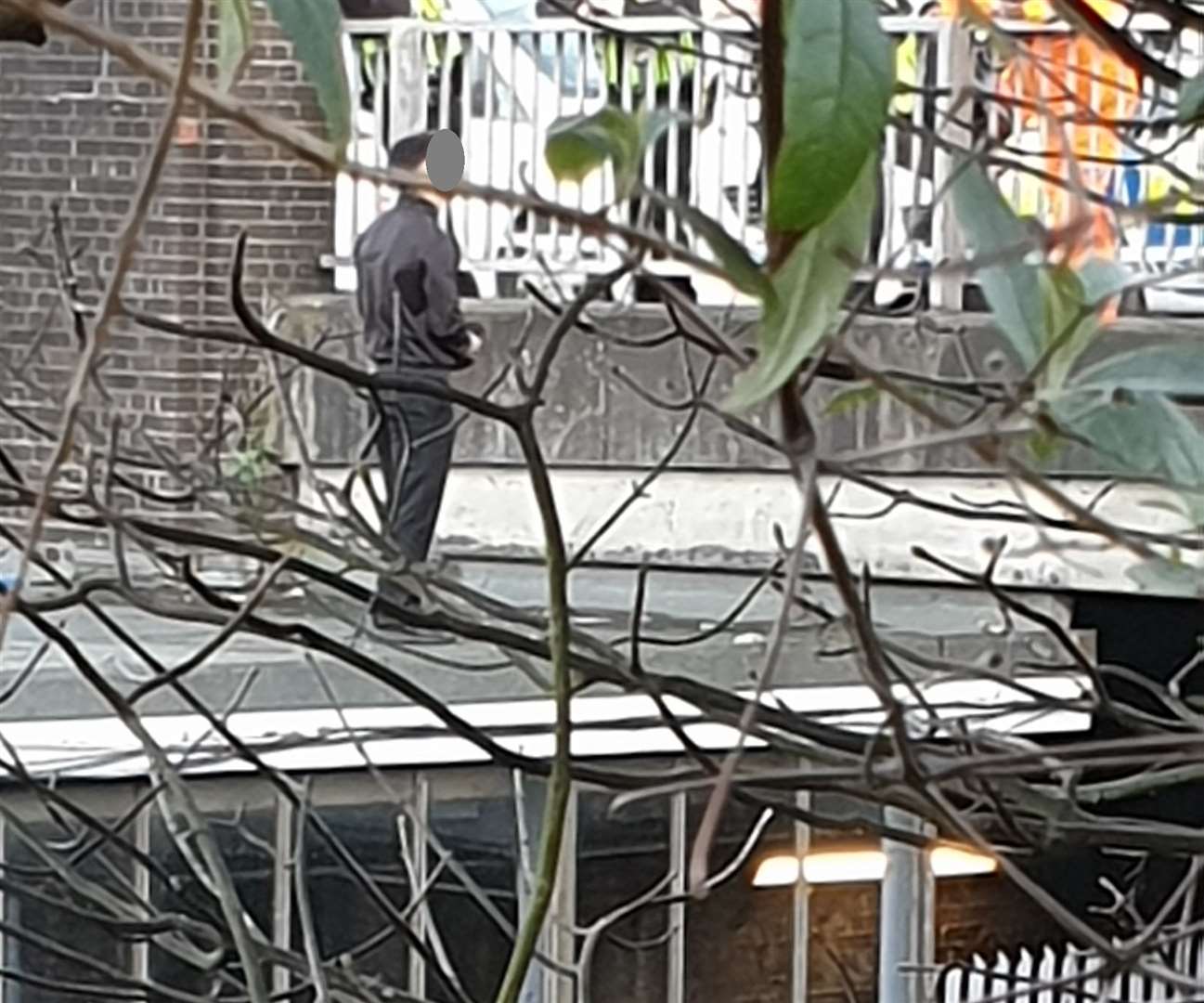 A man has been seen walking along the bridge and on a roof near Chatham Railway Station. Picture: Kim Young