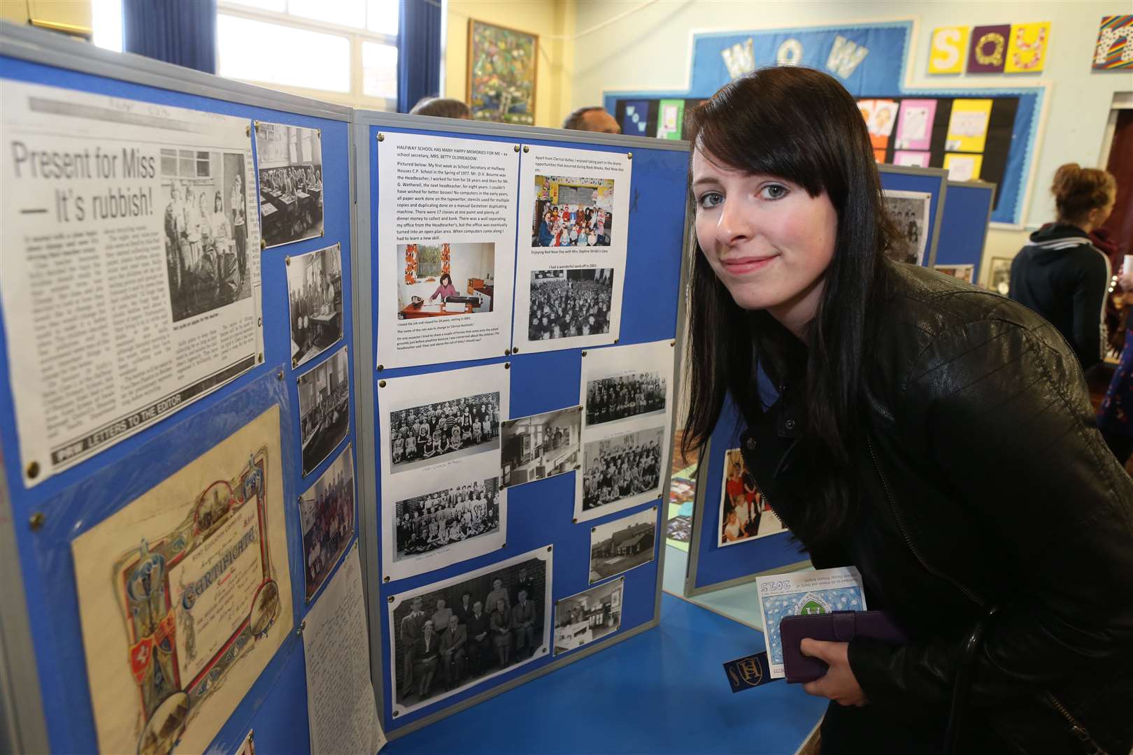 Gemma Wilmshurst, who was a pupil between 1990-1994, looks at a memory display at Halfway Houses Primary School