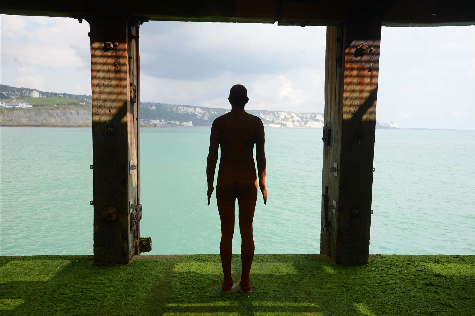 An Antony Gormley statue, which remains at Folkestone's Harbour Arm and featured in the 2017 triennial
