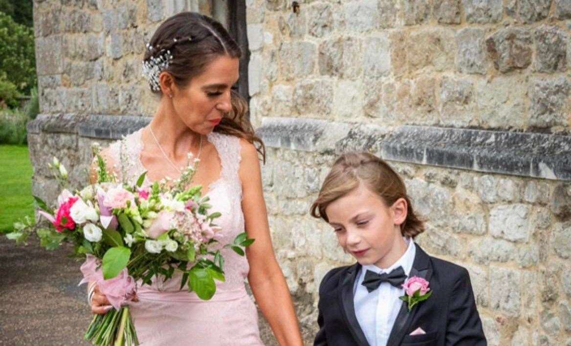 Cassandra Baker with her son George who her walked her down the aisle at her weddings. Picture: Steve Ayres