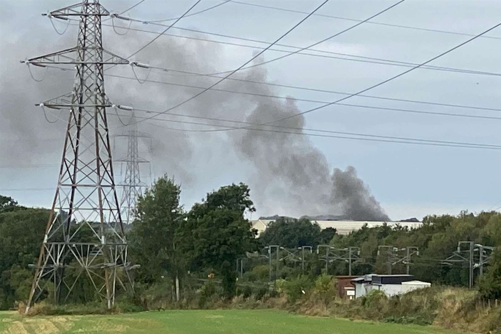 Smoke can be seen billowing from the site. Photo: Barry Goodwin