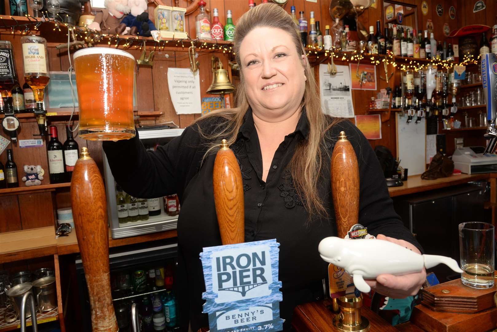 Lizzie Brown, Landlady of the Ship and Lobster pub in Marks Lane, Gravesend and a pint of Benny's Beer. Picture: Chris Davey. (5378424)
