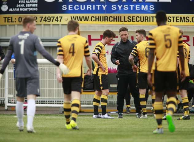 Maidstone look for answers during a break in play Picture: Martin Apps